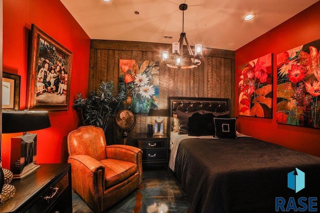 bedroom featuring a notable chandelier