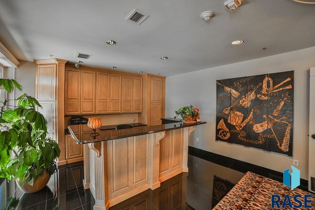 bar featuring dark tile patterned flooring