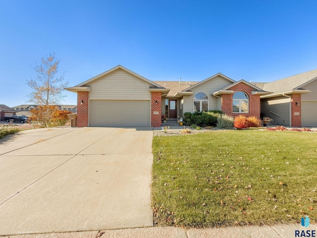 single story home with a front yard and a garage