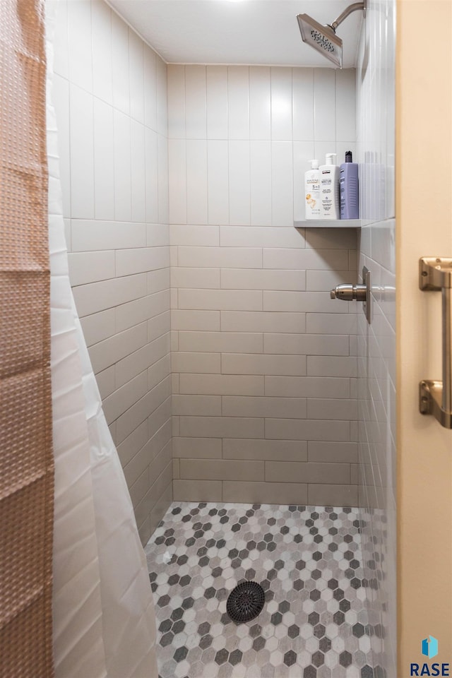 bathroom with a shower with shower curtain