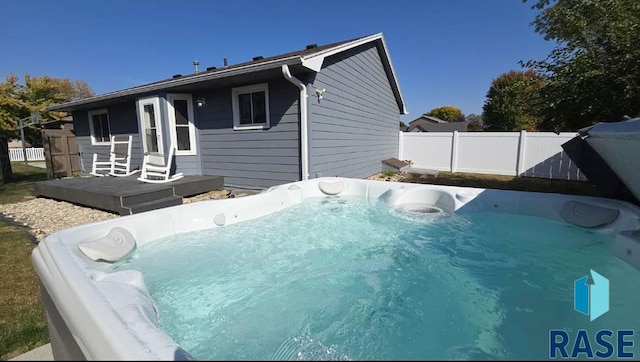 exterior space with a hot tub