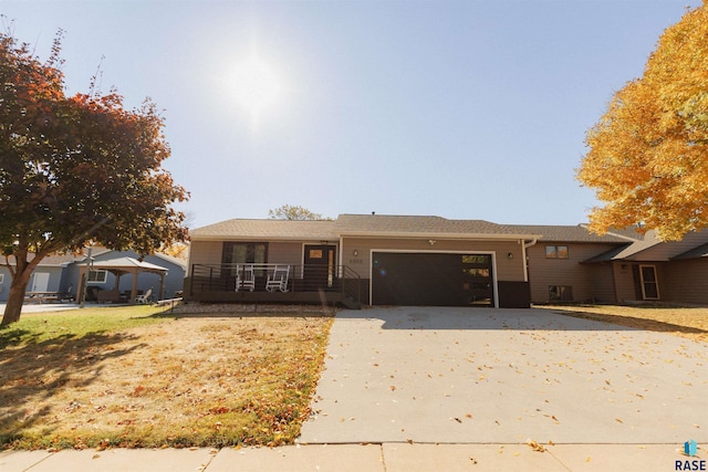 view of front facade featuring covered porch and a garage