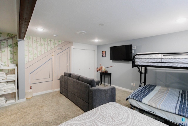 carpeted bedroom with a closet