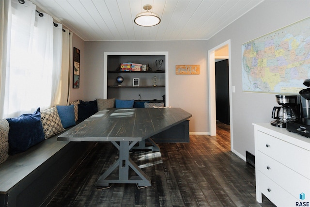 dining room with breakfast area, wooden ceiling, and dark hardwood / wood-style floors