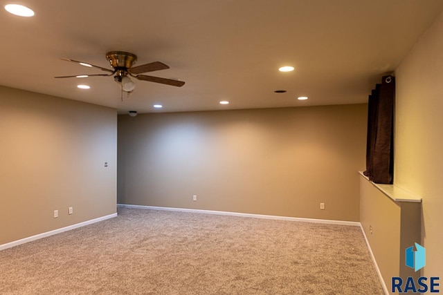 empty room featuring carpet flooring and ceiling fan