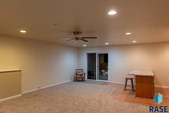 spare room with ceiling fan and light hardwood / wood-style flooring