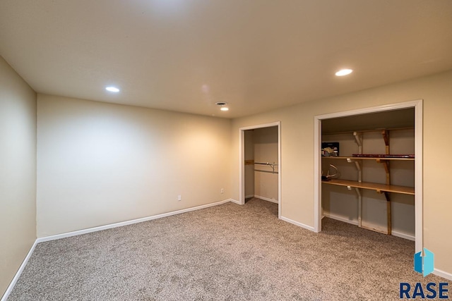 unfurnished bedroom with carpet flooring and a closet