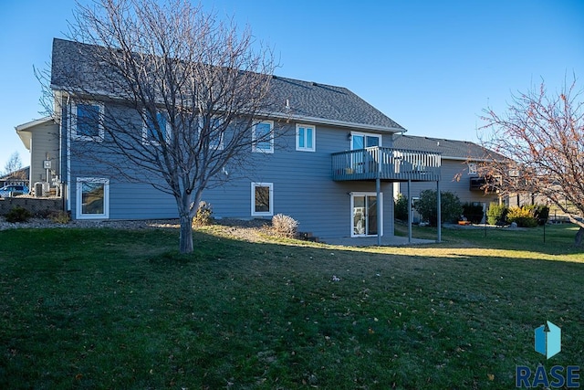 back of house with a lawn and a wooden deck