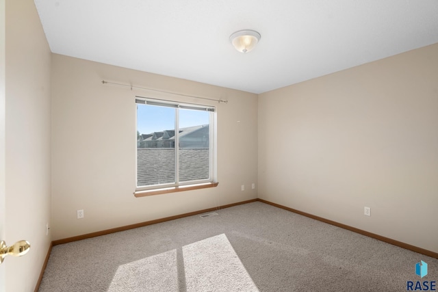 unfurnished room featuring carpet floors