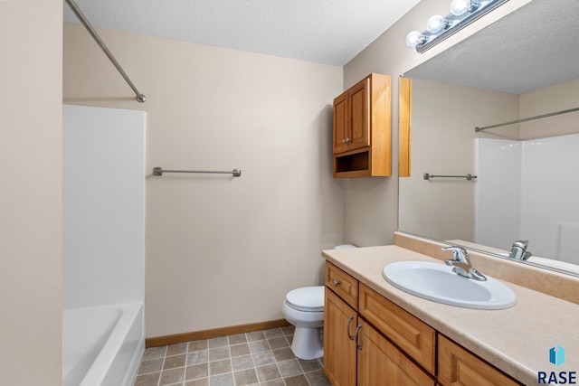 full bathroom featuring vanity, toilet, a textured ceiling, and bathing tub / shower combination