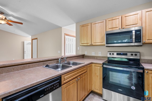 kitchen featuring light brown cabinetry, ceiling fan, sink, and stainless steel appliances