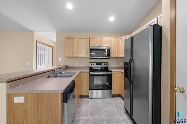 kitchen with kitchen peninsula, appliances with stainless steel finishes, light brown cabinets, and sink