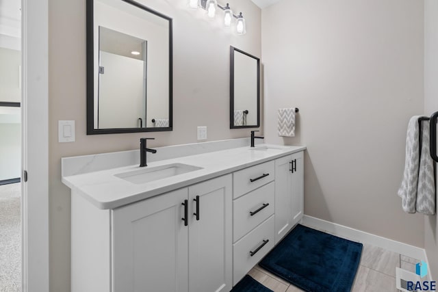 2704 S Snow Mass Ave, Sioux Falls, SD 57110 - full bath with double vanity and baseboards