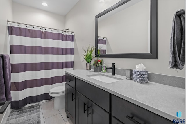 2704 S Snow Mass Ave, Sioux Falls, SD 57110 - bathroom with vanity, toilet, tile patterned flooring, and curtained shower
