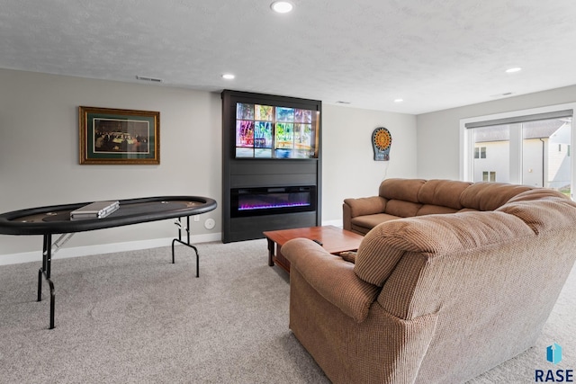 2704 S Snow Mass Ave, Sioux Falls, SD 57110 - living area featuring baseboards, a glass covered fireplace, carpet, and recessed lighting