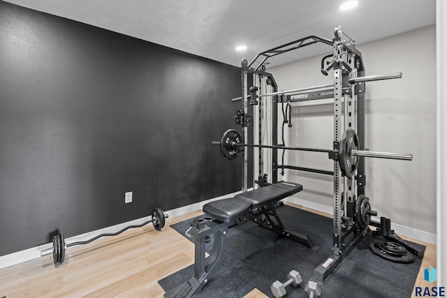 2704 S Snow Mass Ave, Sioux Falls, SD 57110 - exercise area featuring baseboards, wood finished floors, and recessed lighting