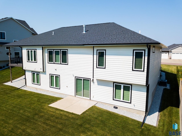 2704 S Snow Mass Ave, Sioux Falls, SD 57110 - rear view of house featuring a yard, a patio area, and roof with shingles