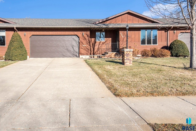 ranch-style home featuring a garage and a front yard