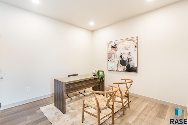 office area with light hardwood / wood-style floors