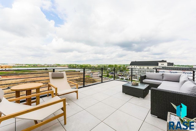 view of patio with an outdoor hangout area and a balcony