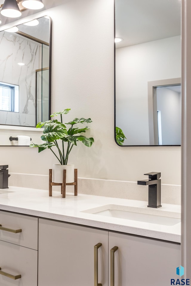 bathroom with vanity and an enclosed shower