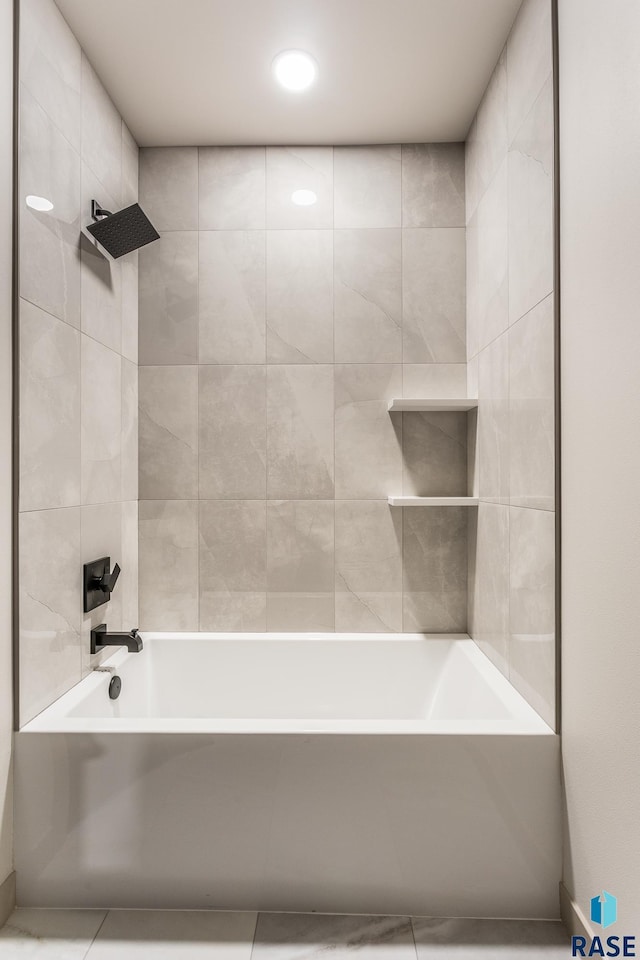 bathroom with tile patterned flooring and tiled shower / bath combo