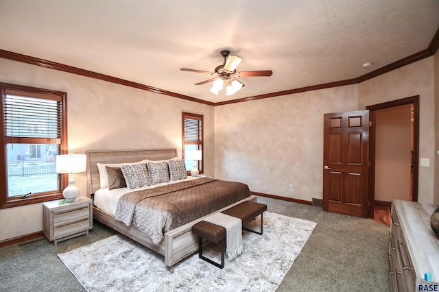 bedroom with ceiling fan, crown molding, carpet floors, and a textured ceiling