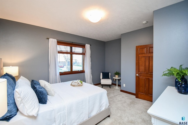 carpeted bedroom with a textured ceiling