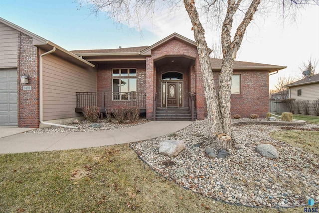 view of front of property with a porch and a garage