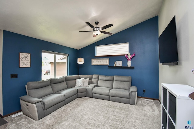 carpeted living room with ceiling fan and lofted ceiling