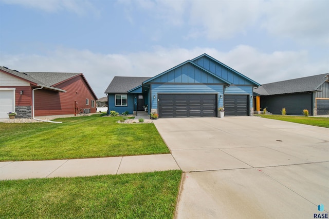 view of front facade with a front yard and a garage