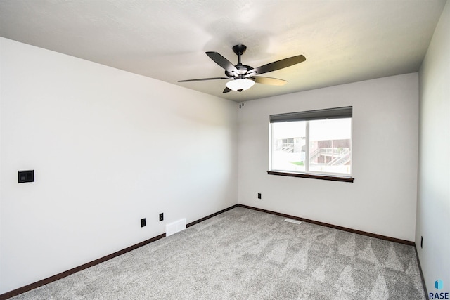 empty room with light carpet and ceiling fan