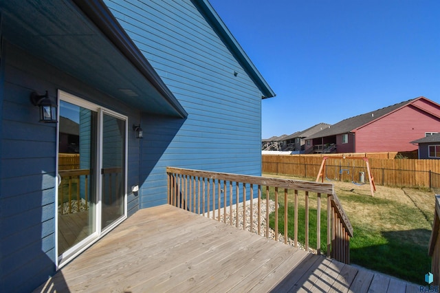 wooden deck with a lawn