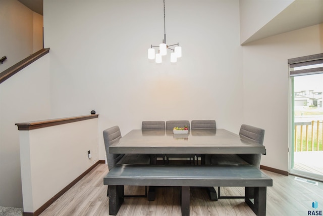 dining space featuring light wood-type flooring