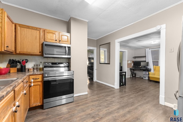 kitchen featuring decorative backsplash, appliances with stainless steel finishes, dark hardwood / wood-style flooring, a textured ceiling, and crown molding