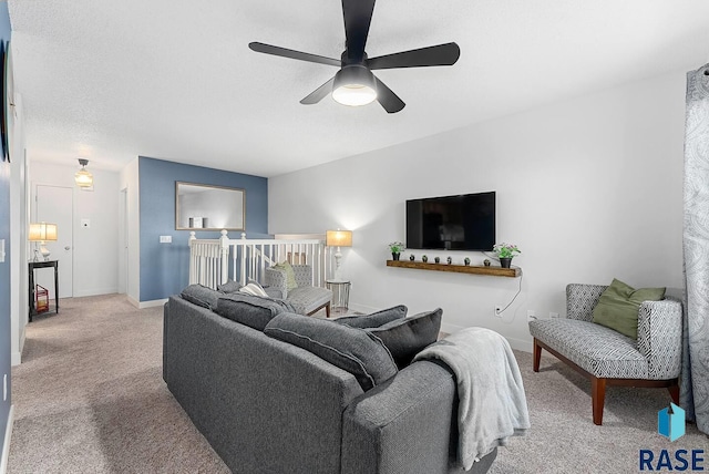 carpeted living room featuring ceiling fan