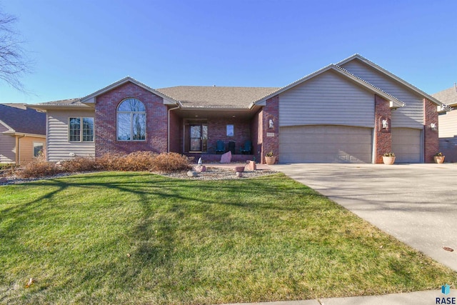 ranch-style home featuring a garage and a front yard