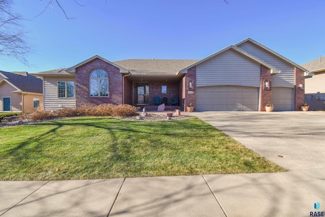 ranch-style home with a garage and a front lawn