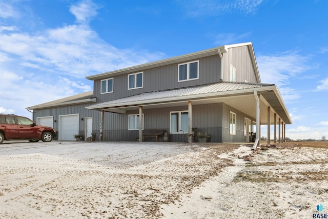 view of front facade with covered porch and a garage