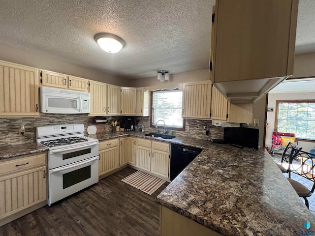 kitchen featuring white appliances, sink, a textured ceiling, tasteful backsplash, and dark hardwood / wood-style flooring