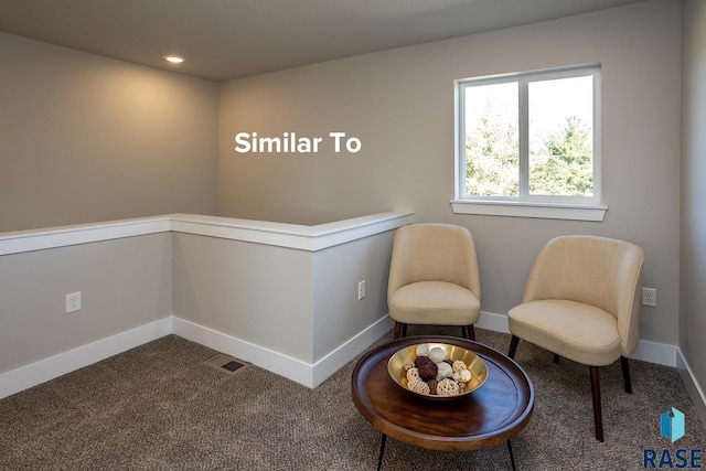 living area featuring carpet floors