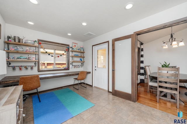 home office with a notable chandelier