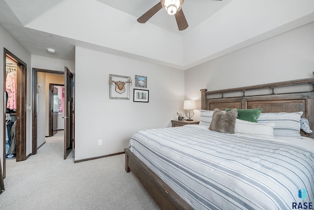 bedroom featuring ceiling fan and light colored carpet