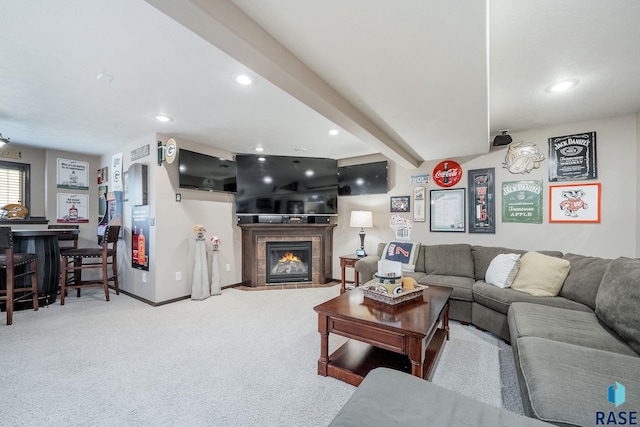 carpeted living room featuring beamed ceiling