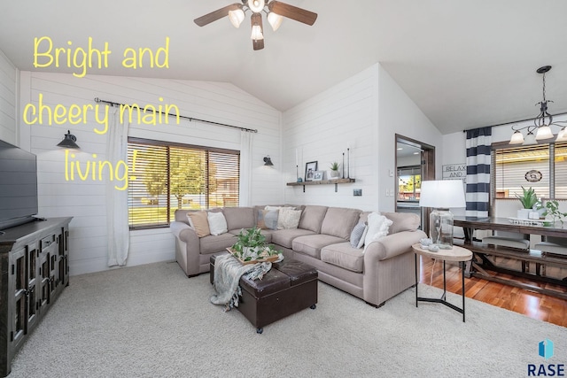 living room with hardwood / wood-style floors, plenty of natural light, ceiling fan, and vaulted ceiling