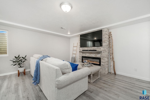 living room featuring a fireplace and hardwood / wood-style flooring