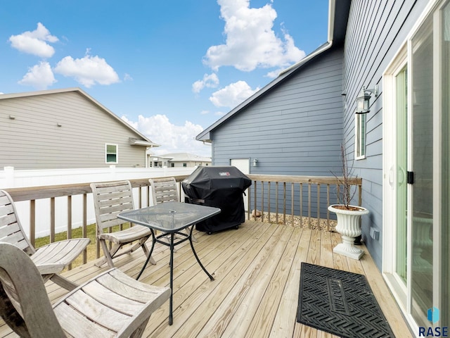 wooden deck featuring grilling area