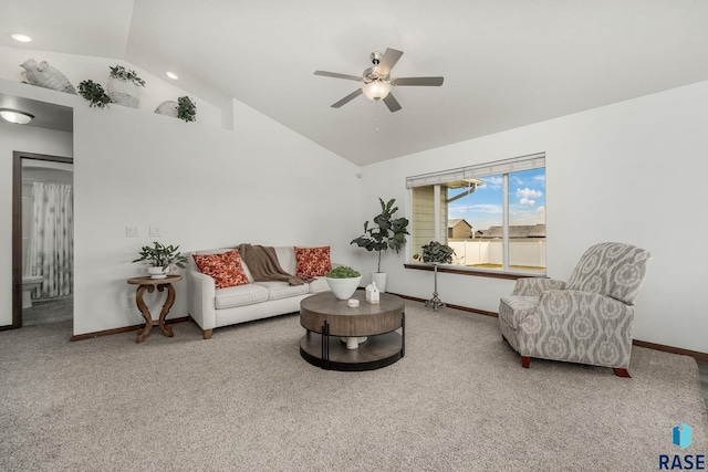 living room featuring ceiling fan, carpet, and vaulted ceiling