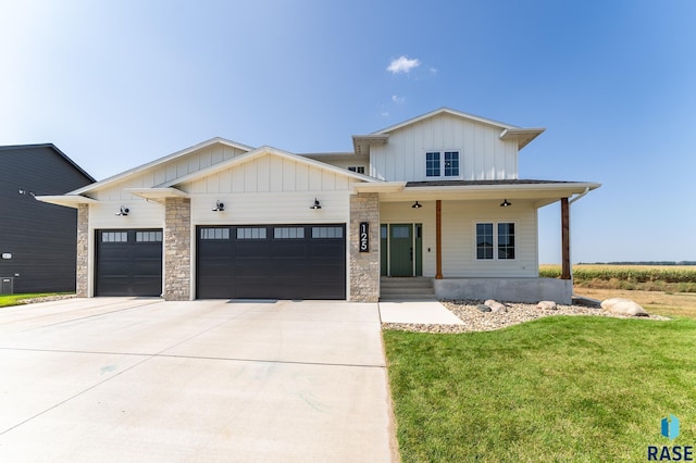 modern farmhouse style home with a porch, a garage, and a front lawn