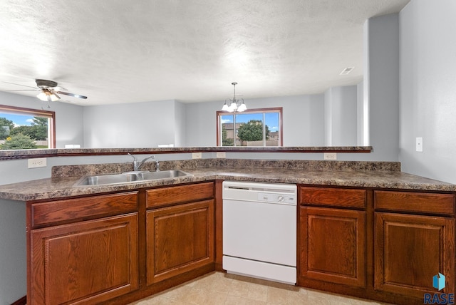 kitchen with dishwasher, a textured ceiling, ceiling fan with notable chandelier, and sink